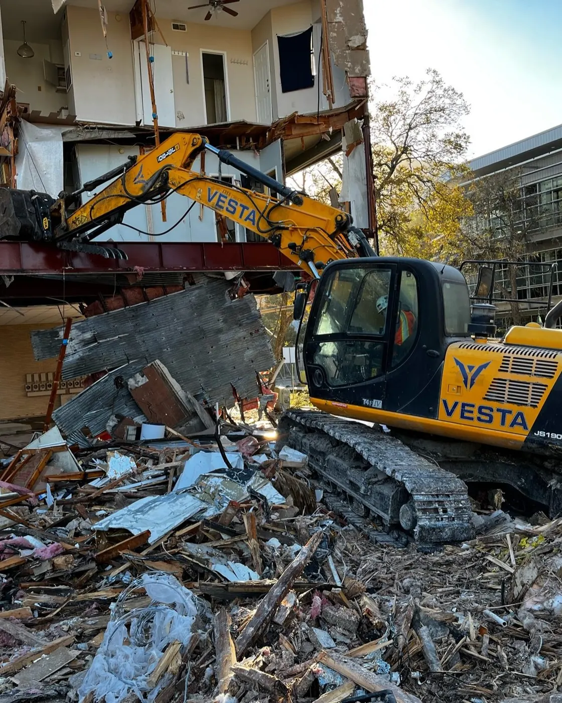 Vesta Commercial demolition excavator on an active job site